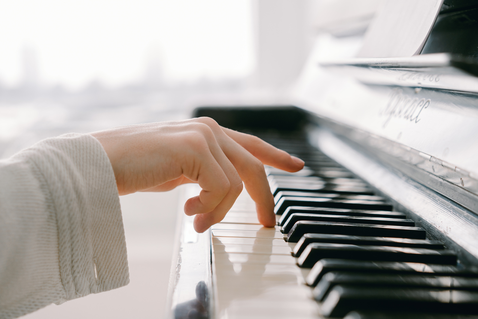 A Person Touching Piano Keys